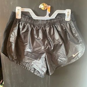 Large, black Nike shorts